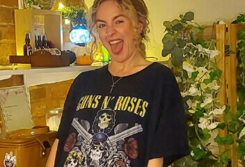 Photo of a woman wearing a guns and roses t-shirt in support of Metal Merch Day
